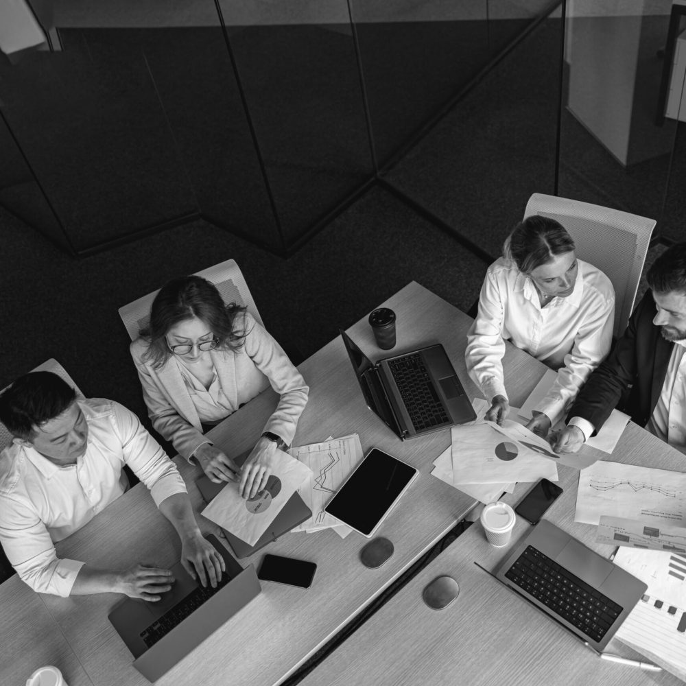 topview of creative agency business brain storm meeting. Team discussing roadmap to product launch